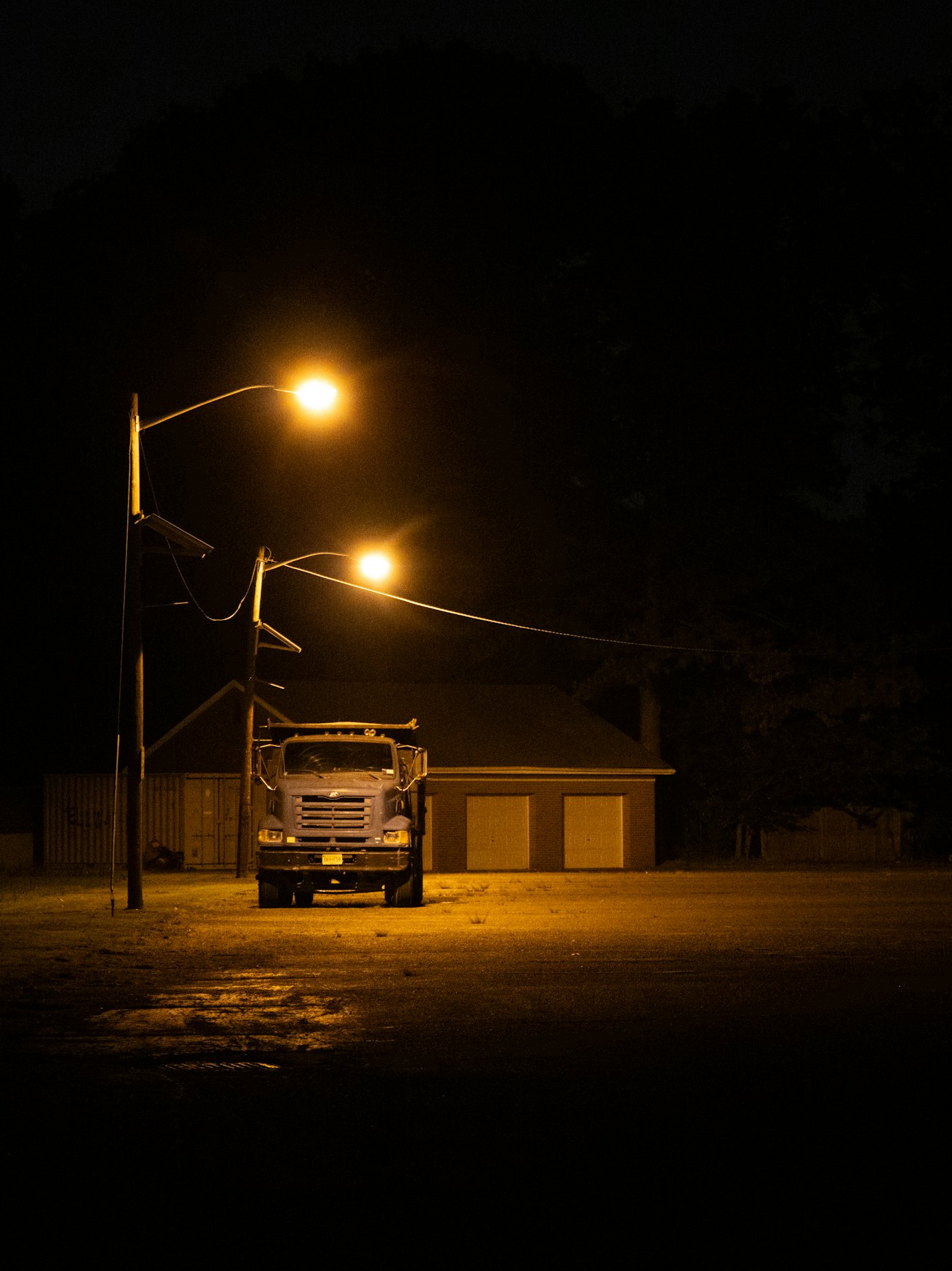 Heavy truck parked overnight under street lights